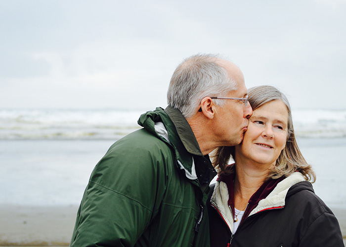 Elderly-Couple Elderly couple stood on a beach