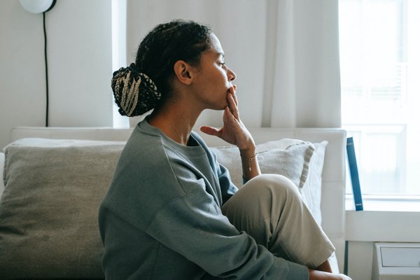Stress-stressed-woman Stressed woman looking through window